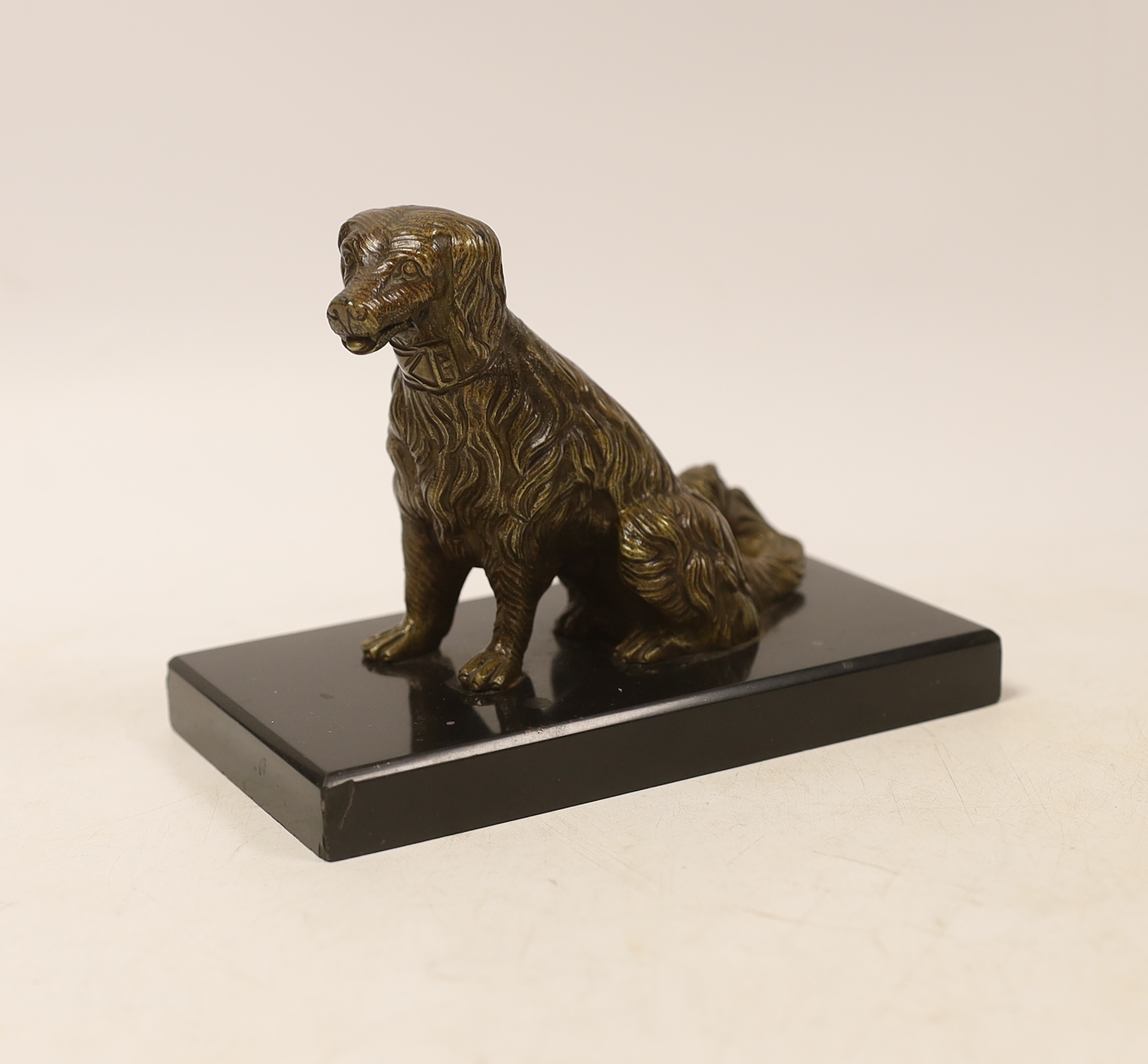 A novelty bronze dog card holder, with articulated jaw, base 14.5cm wide
